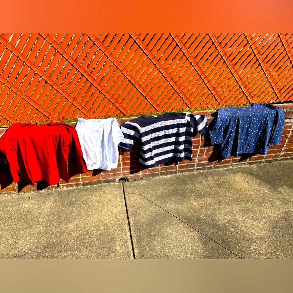4 women’s tops for $15.00. Red white and blue! The striped one is a sweater.